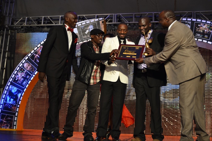 'Felistas Fable' Producer/Director, Dilman Dila (2nd R), is joined on the podium by some of his cast to receive the award for Best Feature Film.