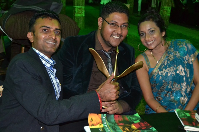 Paresh Gondaliya (L), the producer and director of 'Superstition', is joined by fellow filmmaker Jayant Maru and actress Edlyn Sabrina to celebrate the film's Best Editing award win.