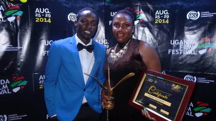 The writer posses for a photo with Best Actress award winner, Farida Kuteesa.