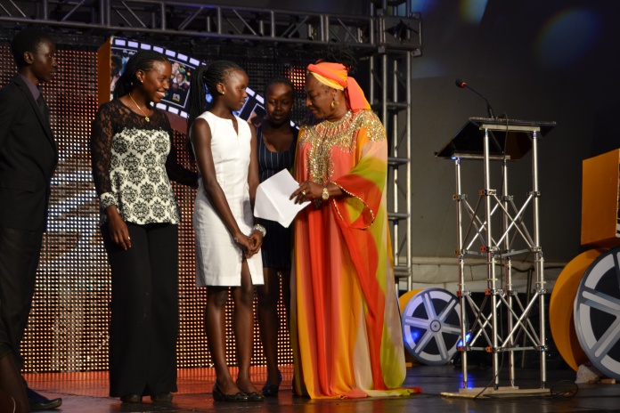 Nigerian actress, Patience Ozokwor, congratulating 13-year-old Rachael Nduhukire (C) for her Special Mention award courtesy of her impressive performance in the short film 'I found My Way'.